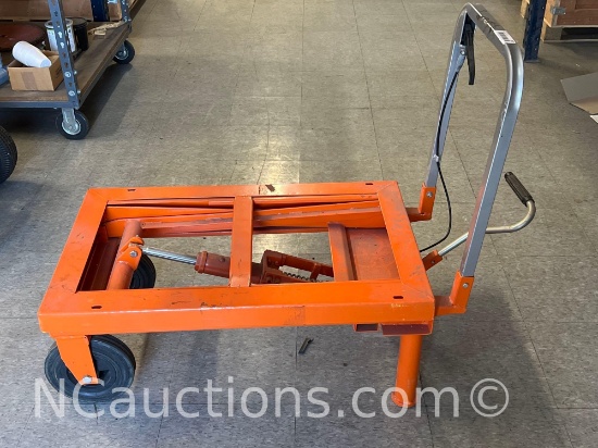 Orange Hydraulic lift cart with wheels upstairs
