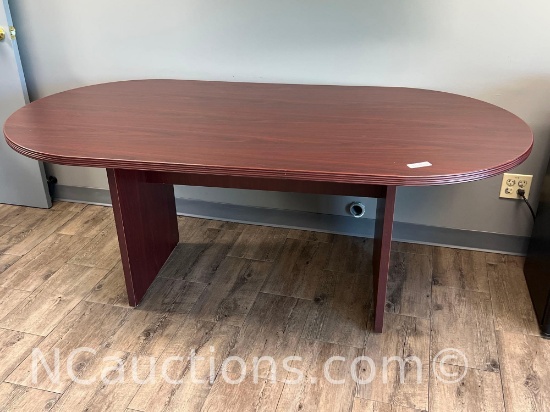 Oval table with a mahogany laminate finish