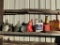 Gas Cans And Funnels On Shelf