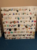 Assorted Lot of Keychains on Both Sides of Board