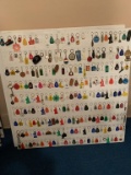 Assorted Lot of Keychains on Both Sides of Board