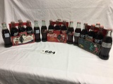 3 collectible on opened Coca-Cola six pack glass bottles