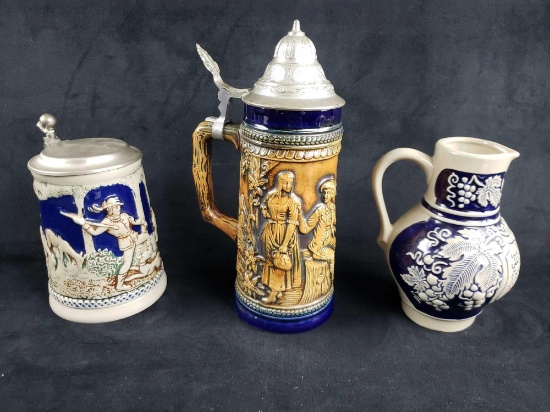 Set of 2 Lidded Beer Steins and 1 Pitcher