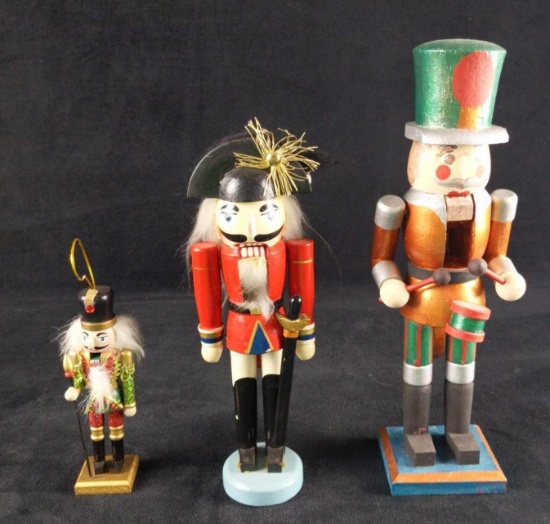 Three Small And Even Smaller Wooden Nutcrackers