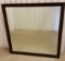 Large beveled mirror. Wood backing. Some scratches around frame 35