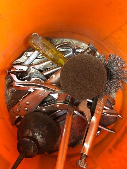 Bucket with vise grips and misc wrenches