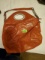 Orange handbag with optionsl shoulder strap