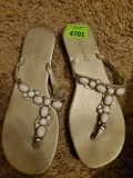 flat silver or pewter flip flops with white beads