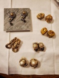 bundle of clip on earrings.