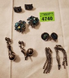 Bundle of silver and blue/green clip on earrings.