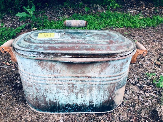 Vintage copper metal bucket with lid featuring wooden handles on each side and on lid