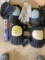 Three pairs of gloves two sets of kneepads and a lighter