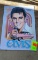 Metal sign of Elvis Presley in the car pink Cadillac he brought his mother