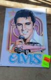 Metal sign of Elvis Presley in the car pink Cadillac he brought his mother