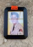 framed picture of Elvis Presley in the military