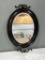 Oval Mirror with Decorative Cast Iron Wall Accents