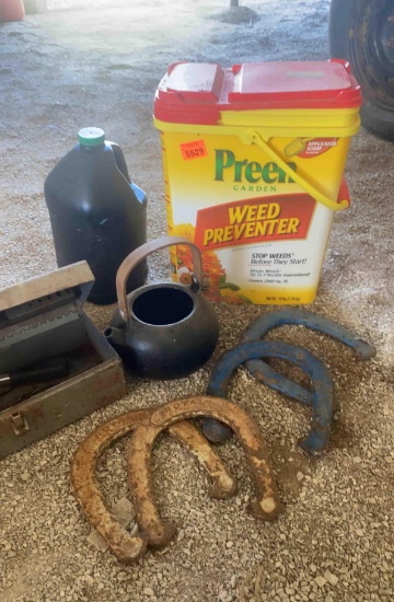 Weed preventer horseshoes metal toolbox with drillbits in it and an antique pot