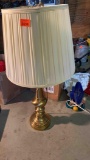 Brass lamp holds two lightbulbs