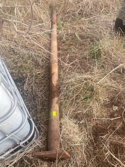 3 inch metal post with plate welded on it approximately 10 foot
