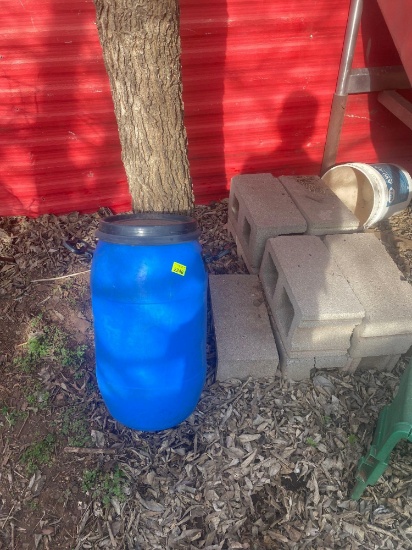 Plastic barrel with lid nine concrete blocks one is broken
