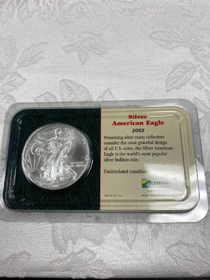 2002 American silver eagle US mint mark 99.93% silver 0.07 copper diameter 46.6 mm weight 31.101 g