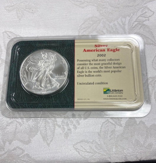 Silver American eagle 2002 US mint white 31.101 g diameter 40.6 mm 99.93% silver and 0.7% copper