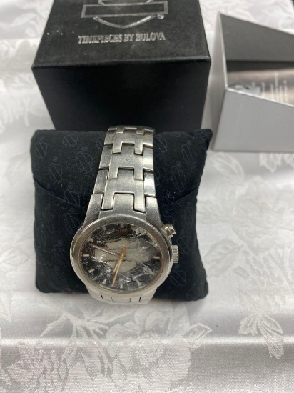 Harley Davidson watch- the lens is damaged. easy fix. The back is also missing.