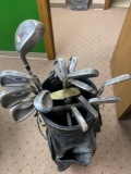 Golf clubs: 3 wood titleist pitching wedge two...9 iron 4 putter few balls, and bag.