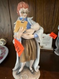 Woman figurine holding baby.