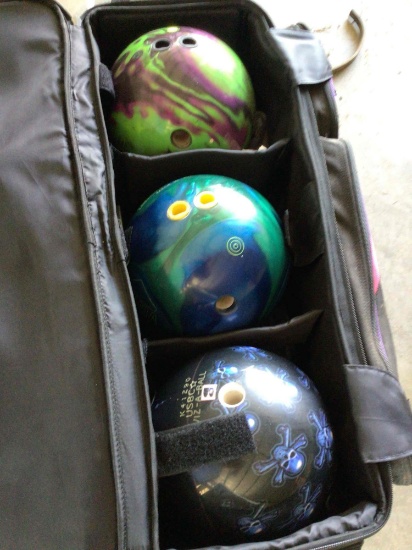 3 bowling balls and carrier