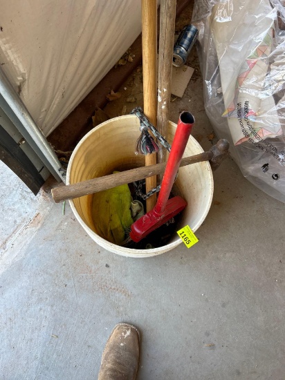 bucket with hammer and other tool handles
