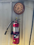 fire extinguisher and clock