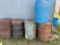 4-50 gallon metal barrels, 1 plastic