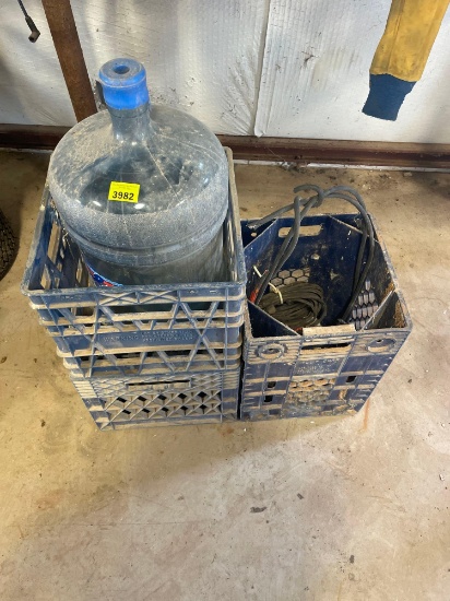 crates; 5 gallon water bottle; insulated wires