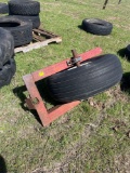 5 lug implement wheel and tire on axle frame