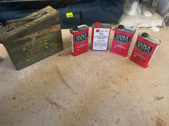 metal ammo container and 4 cans of black powder