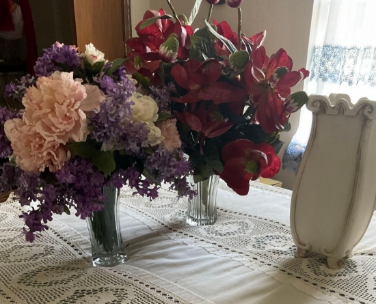 Artificial flowers and vases plus one white vase by itself