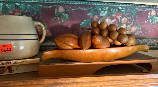 Crock and wooden platter of wooden grapes, pears, bananas