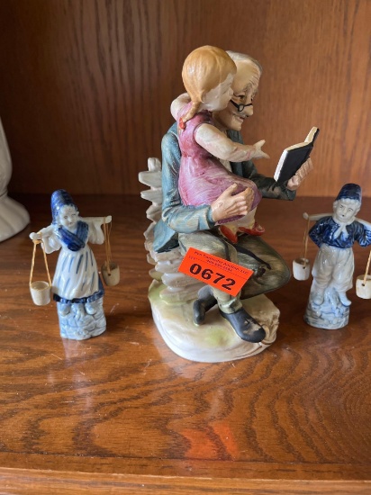 Vintage porcelain figurine of a doctor and a child. Vintage porcelain Ancienne couple porteur.