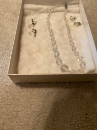Costume jewelry, her necklace, and two pairs of earrings