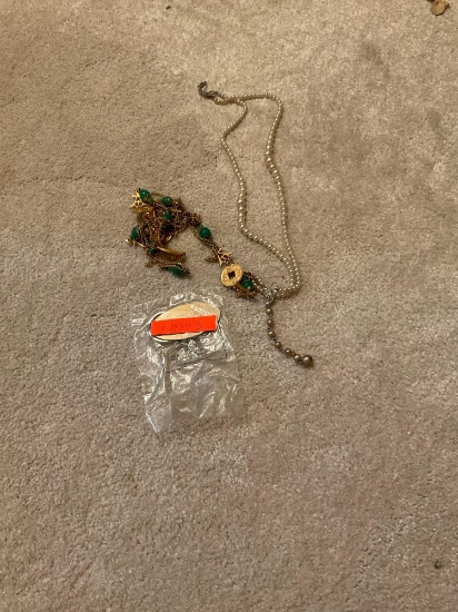 Keychain and tangled up necklaces