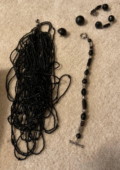 Necklace earrings, a rosary and a little wooden box
