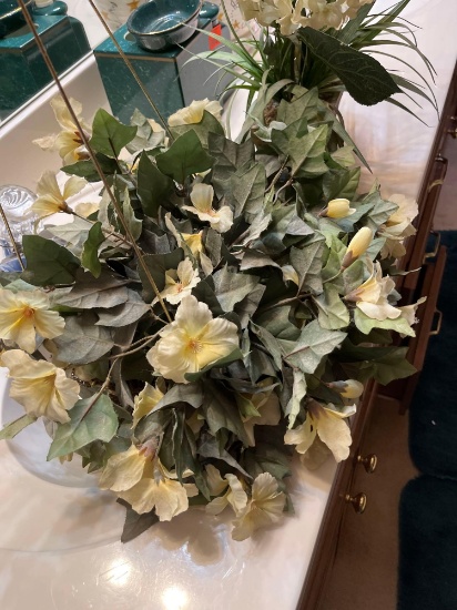 Hanging basket of artificial flowers and a basket of artificial flowers by itself