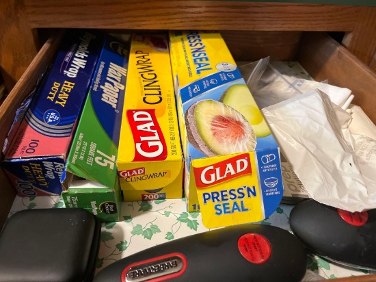 2 Farberware can openers, Reynolds wrap heavy duty tin foil, Wax paper, Cling wrap, press and seal