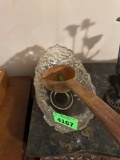 Decorative glass bowl with wooden ladle