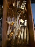 Silverware some mixture, some more silver and color and some more golden color .