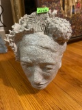 Home decor art made out of artificial fossil made to look like a persons head