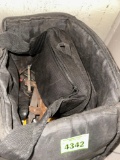 Black bag with a few tools in them
