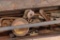 Metal tool box with a few hand tools inside