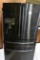 Samsung refrigerator and freezer with water and ice in the door and a separate area for keeping